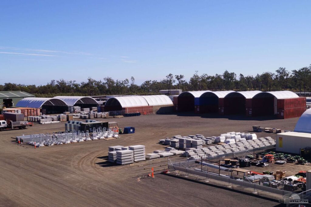 An industrial work site using container dome shelters.