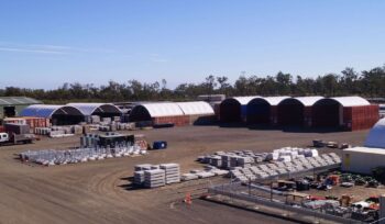 An industrial work site using container dome shelters.