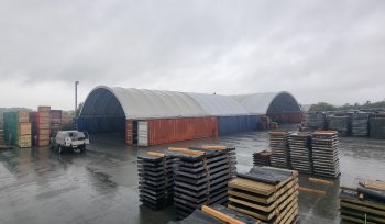 a warehouse with stacks of wood