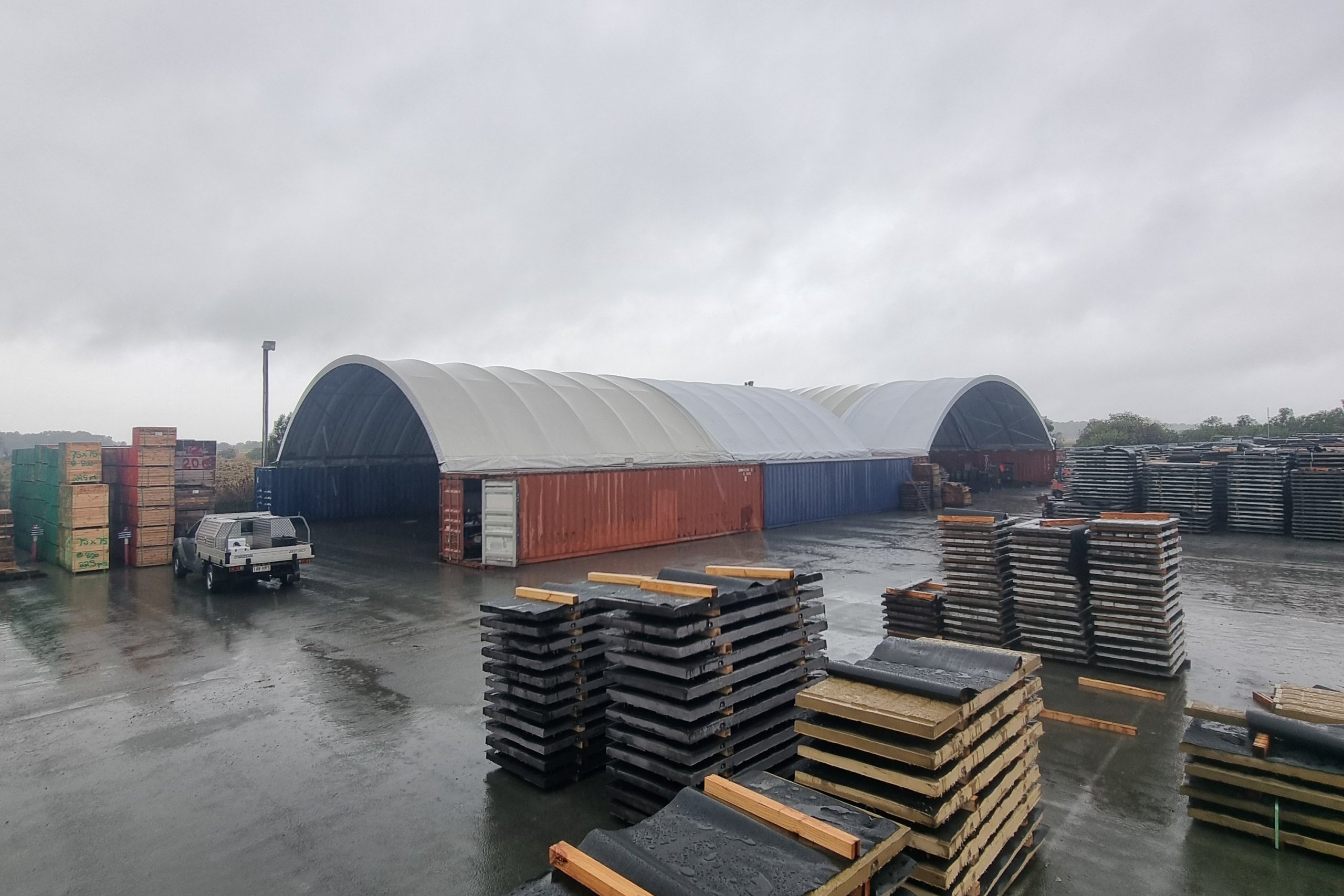 a warehouse with stacks of wood