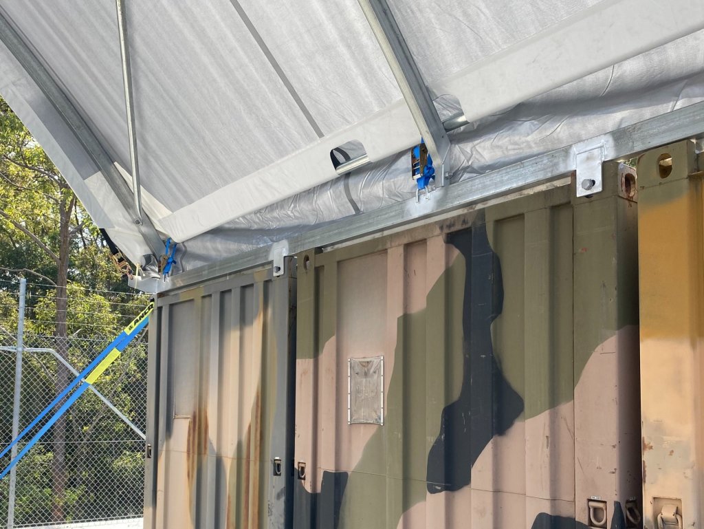 a camouflage painted metal containers