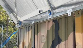 a camouflage painted metal containers